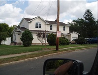 white home with dormer addition